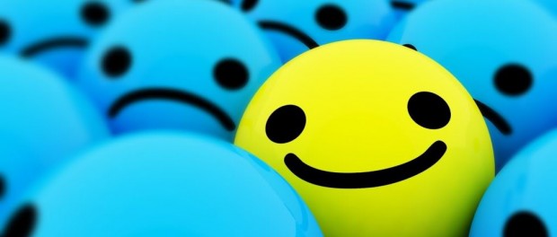 An image of a bunch of smiley being blue and sad, with one yellow happy one mixed in.