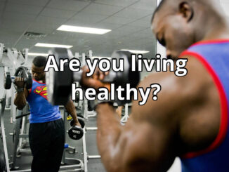 A man doing a biceps curl at the gym