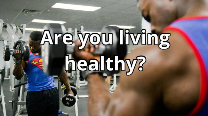 A man doing a biceps curl at the gym