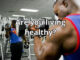 A man doing a biceps curl at the gym